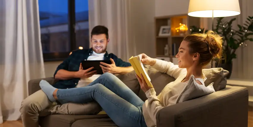 Happy Couple Loungng In Living Room